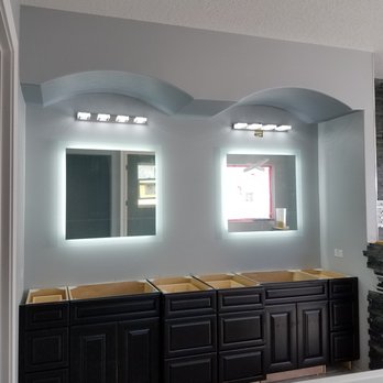 Synergy Electric - a bathroom with a bathtub and two sinks - Electricians Near Me Synergy Electric - a bathroom with a bathtub and two sinks - Electricians Near Me