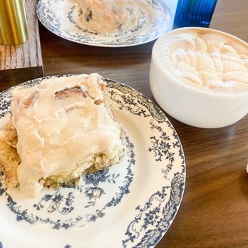 Blue House Bakery & Cafe - Apple cinnamon roll, chocolate chip biscuit,and honeybee latte on the right. - Cafes Near Me - Bryant, Arkansas Blue House Bakery & Cafe - Apple cinnamon roll, chocolate chip biscuit,and honeybee latte on the right. - Cafes Near Me - Bryant, Arkansas