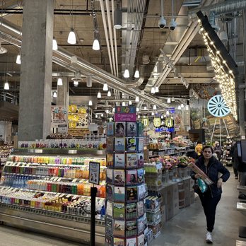 Fresh St. Market - a woman in a grocery store - Grocery Near Me - Vancouver, British Columbia