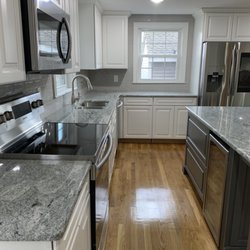 Wall To Wall Home Improvement - New hardwood floors and kitchen. Island with built in wine fridge