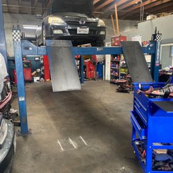 JNJ Auto Repair 2 - Working in car