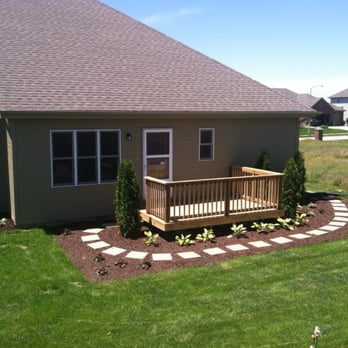 Dandy Lawn Care - a home with a wooden deck - Landscaping Near Me - Omaha, Nebraska Dandy Lawn Care - a home with a wooden deck - Landscaping Near Me - Omaha, Nebraska