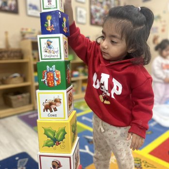 Learning Minds Daycare - Building tower with blocks - Child Care & Day Care Near Me - Milpitas, California