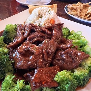 Yen Ching - House beef - A dish featuring beef with broccoli, rice, and an egg roll served on a white plate at a Chinese restaurant. - Chinese Near Me - Ozark, Missouri