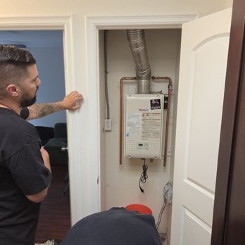 Lvl Up Plumbing - Jonathan hard at work with our dead tankless water heater. - Water Heater Installation/Repair Near Me - Ontario, California Lvl Up Plumbing - Jonathan hard at work with our dead tankless water heater. - Water Heater Installation/Repair Near Me - Ontario, California