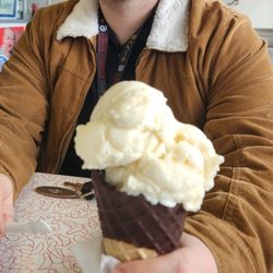 Bubbles Ice Cream Parlor - Vanilla ice cream dipped cone