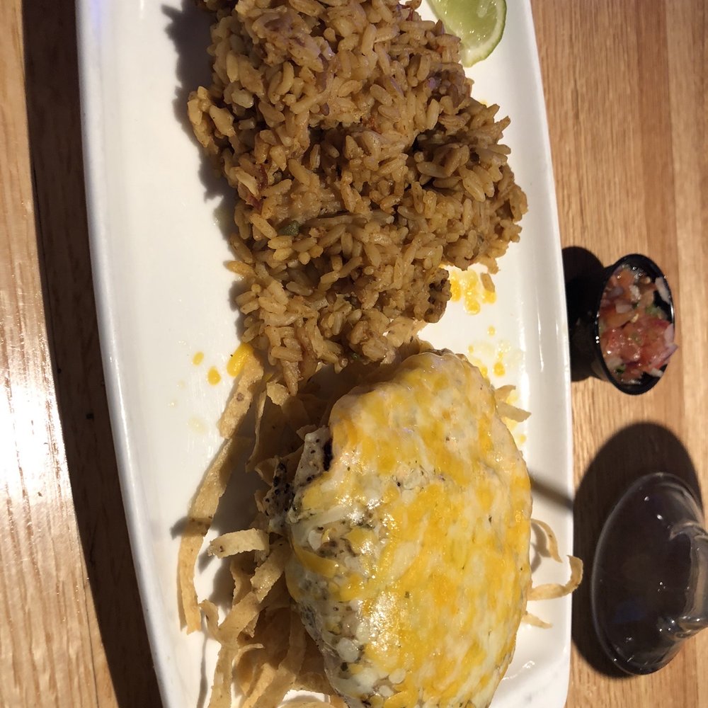 Applebee's Grill + Bar - fiesta chicken on crunchy tortilla chips with heat-in-the-microwave rice. I'm not certain about that but it was not desirable. - American Near Me - Athens, Texas