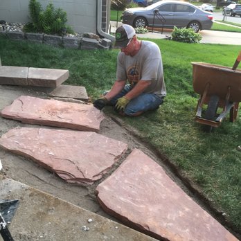 Total Lawn and Landscaping - Expert at work on Flagstone - Landscaping Near Me - Omaha, Nebraska Total Lawn and Landscaping - Expert at work on Flagstone - Landscaping Near Me - Omaha, Nebraska