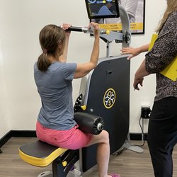 Osteostrong Central Paramus - Client being coached on the core growth trigger machine- building bone density in spine, ribs, pelvis!