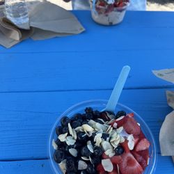 Playa Bowls - Banana base with strawberries blueberries sliced almonds and granola