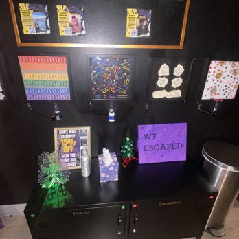 Entangled - Orange - Lockers and a couple mind / practice games on the wall to utilize before you begin your official escape room. - Escape Games Near Me - Orange, California
