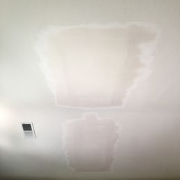 the just-finished drywall patch, still wet the just-finished drywall patch, still wet