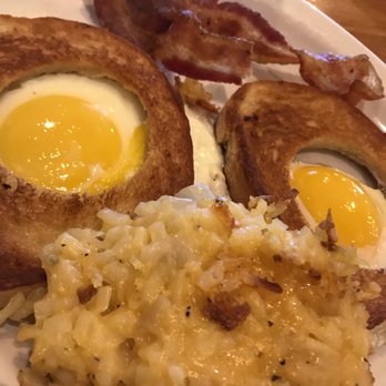 Cracker Barrel Old Country Store - Eggs in a Hole- Sunny Side eggs with bacon and housemade hashbrowns - Breakfast & Brunch Near Me - Gainesville, Florida Cracker Barrel Old Country Store - Eggs in a Hole- Sunny Side eggs with bacon and housemade hashbrowns - Breakfast & Brunch Near Me - Gainesville, Florida