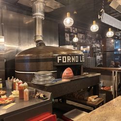 IL FORNO A LEGNA - Wood burning oven in the kitchen.