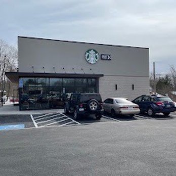 Starbucks - a starbucks coffee shop with cars parked in front of it - Coffee & Tea Near Me - Torrington, Connecticut Starbucks - a starbucks coffee shop with cars parked in front of it - Coffee & Tea Near Me - Torrington, Connecticut
