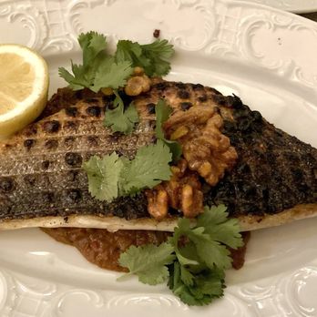 Suraya - Samke Harra (Branzino) Over Red Pepper Sauce - Lebanese Near Me - Philadelphia, Pennsylvania