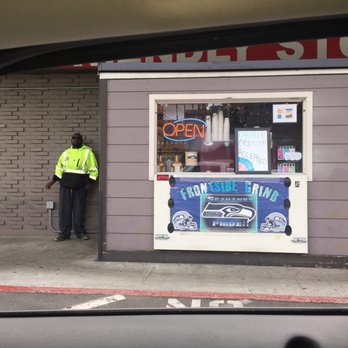 Frontside Grind - a man standing in front of a store - Coffee & Tea Near Me - Seattle, Washington Frontside Grind - a man standing in front of a store - Coffee & Tea Near Me - Seattle, Washington