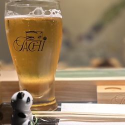 Orion beer in a chilled glass and a Panda (my spirit animal