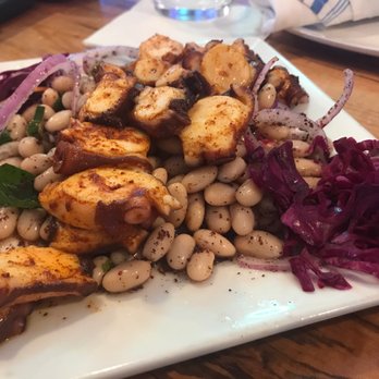 Aroma Mediterranean Cuisine - Octopus over bean salad - Mediterranean Near Me - Rehoboth Beach, Delaware Aroma Mediterranean Cuisine - Octopus over bean salad - Mediterranean Near Me - Rehoboth Beach, Delaware