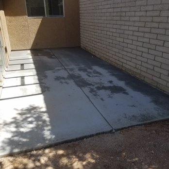 Salvador's Landscape - a concrete patio with a door and window - Landscaping Near Me Salvador's Landscape - a concrete patio with a door and window - Landscaping Near Me