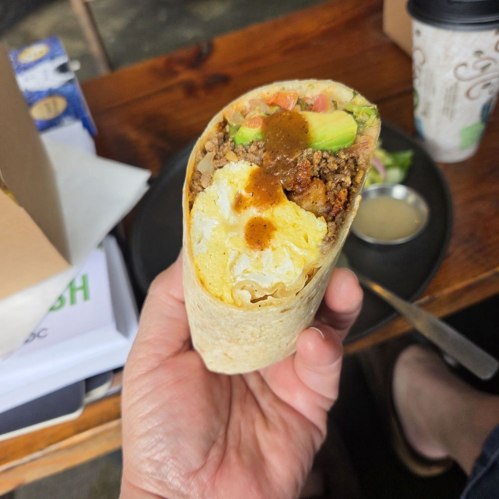 Steel Cup Café - 1/2 of the Breakfast burrito with hot sauce - Sandwiches Near Me - Long Beach, California Steel Cup Café - 1/2 of the Breakfast burrito with hot sauce - Sandwiches Near Me - Long Beach, California