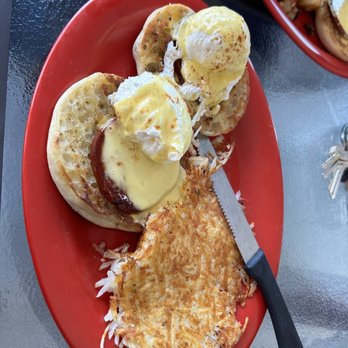 AM Cafe - a plate of eggs benedict and hash browns - Breakfast & Brunch Near Me - New Smyrna Beach, Florida