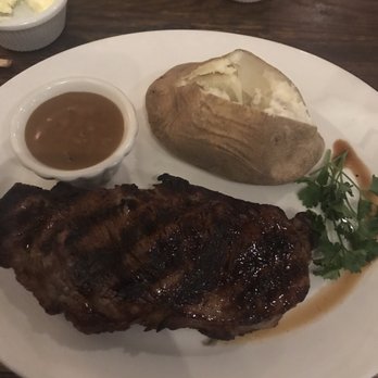 The Hardcover Restaurant - NY Strip w/ baked potato and peppercorn sauce on the side - Steakhouses Near Me - Danvers, Massachusetts The Hardcover Restaurant - NY Strip w/ baked potato and peppercorn sauce on the side - Steakhouses Near Me - Danvers, Massachusetts