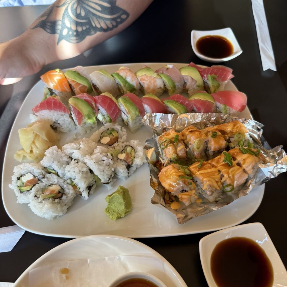 Baked salmon,rainbow with spicy tuna, aloha roll and philly roll Baked salmon,rainbow with spicy tuna, aloha roll and philly roll