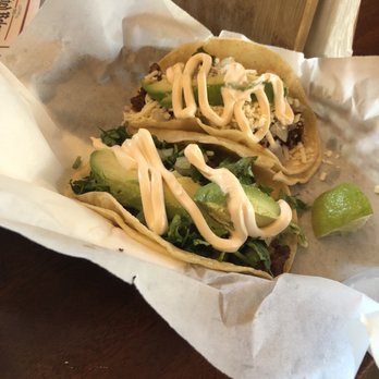 Lazarus Brewing - Mole Chicken and Al Pastor Taco with sour cream and avocado - Breweries Near Me - Austin, Texas Lazarus Brewing - Mole Chicken and Al Pastor Taco with sour cream and avocado - Breweries Near Me - Austin, Texas