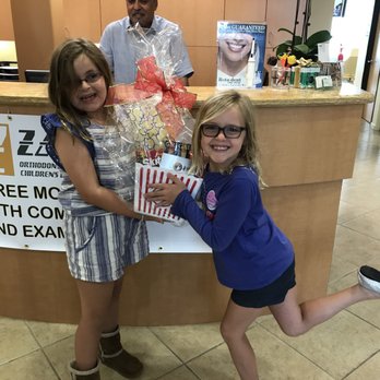 Zand Orthodontics - Two of our patients enjoying their raffle prize! - Orthodontists Near Me - Foothill Ranch, California Zand Orthodontics - Two of our patients enjoying their raffle prize! - Orthodontists Near Me - Foothill Ranch, California