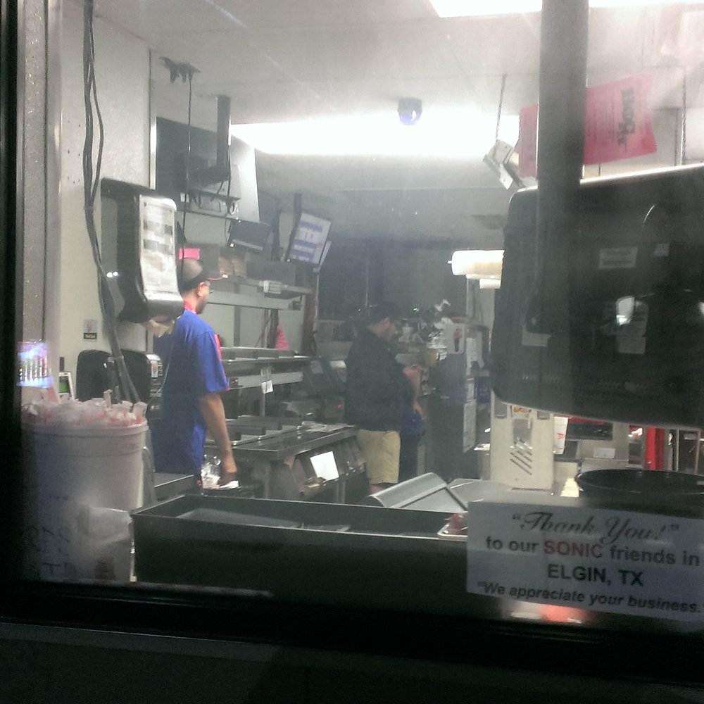 Sonic Drive-In - Employees were too busy texting to take my order at the drive through.  Honked.  Still too busy.  The manager, "No, its not like that." - Burgers Near Me - Elgin, Texas