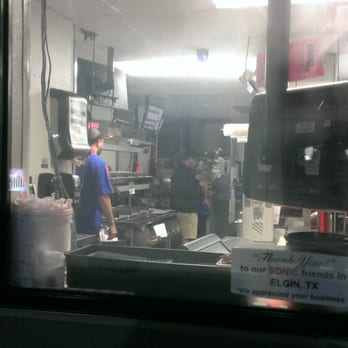 Sonic Drive-In - Employees were too busy texting to take my order at the drive through.  Honked.  Still too busy.  The manager, "No, its not like that." - Burgers Near Me - Elgin, Texas