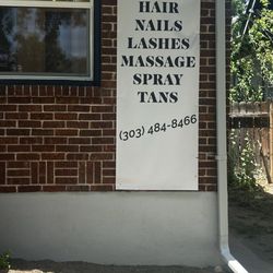 COR VAN SALON - On the outside of the building with the services they offer in their phone number