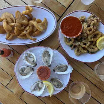 Claudio's Waterfront - Half oysters, fries & calamari with dirty martinis - Seafood Near Me - Greenport, New York Claudio's Waterfront - Half oysters, fries & calamari with dirty martinis - Seafood Near Me - Greenport, New York