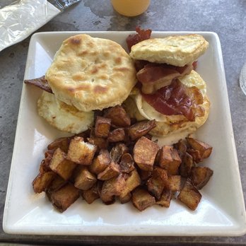 Solé On the Green - bacon egg and cheese melt on a biscuit with a side of home fries - Southern Near Me - Clemson, South Carolina Solé On the Green - bacon egg and cheese melt on a biscuit with a side of home fries - Southern Near Me - Clemson, South Carolina