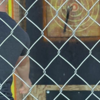 Game On NW Family Fun Center - Hitting the bullseye in axe throwing. - Laser Tag Near Me - Everett, Washington