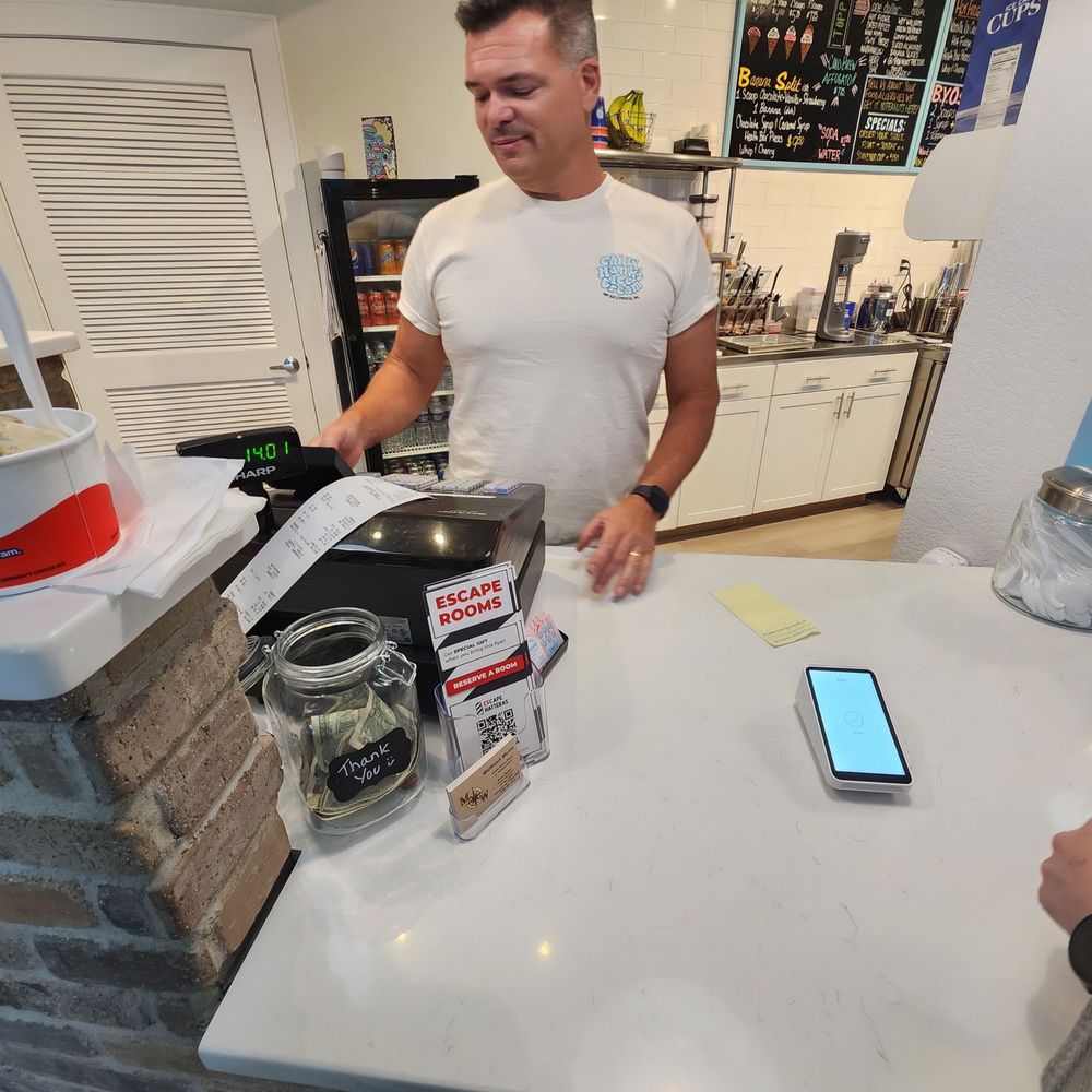The Scoop - a man standing at a counter in a kitchen - Ice Cream & Frozen Yogurt Near Me - Frisco, North Carolina The Scoop - a man standing at a counter in a kitchen - Ice Cream & Frozen Yogurt Near Me - Frisco, North Carolina