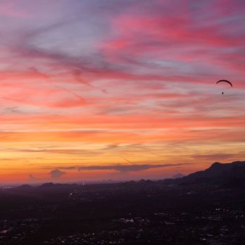 Lost Dutchman State Park - Sunset with a paraglider in top right - Parks Near Me - Apache Junction, Arizona