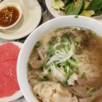 Pho Kien Giang - Pho dac biet with a side of thinly sliced raw beef to dunk as you eat. - Vietnamese Near Me - Pinellas Park, Florida