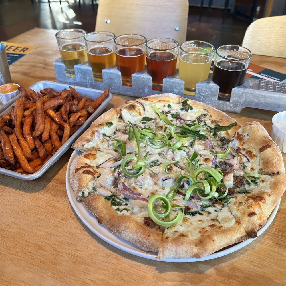 Common Block Brewing Company - Beer flight with pizza and fries - New American Near Me - Medford, Oregon