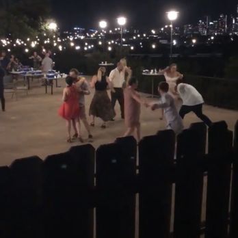 Zilker Park Clubhouse - Friends dancing on the patio overlooking the city lights - Venues & Event Spaces Near Me - Austin, Texas