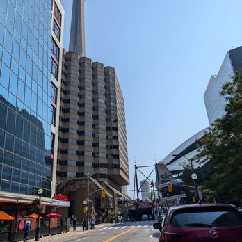 Rogers Centre - Afternoon Jays game. Rogers Centre is on the right. The CN Tower is in the back, on the left. - Stadiums & Arenas Near Me - Toronto, Ontario