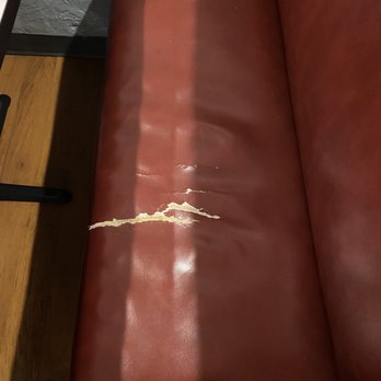 Aegean Restaurant - My seat that had absolutely no padding to the point I felt like I was sitting on hard wood - Greek Near Me - Shalimar, Florida