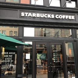 the entrance of a starbucks coffee shop