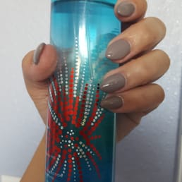Nails by kelly. Acrylic fs w/ taupe gel color. Shape is a little bit of stiletto and almond.
