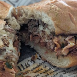 Iguana Bananas - Torta with Asada. They also add ham, cilantro, and spicy salsa as options.