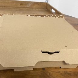 Unsecured box the pizza was delivered in.