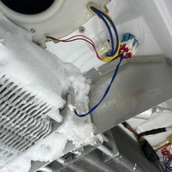 VSH Appliance Repair - Same coil close up. Frost has grown up into the fan intake and over the wiring harness, which is where the airflow gets lost.