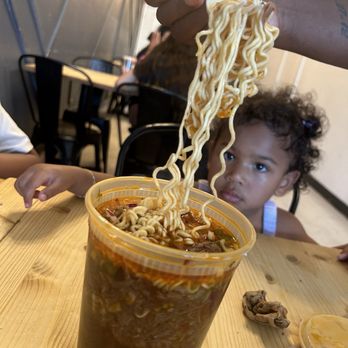 Papi Clary's Kitchen - Daughter looking at dads birria ramen - Asian Fusion Near Me - Concord, California