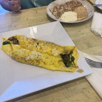 Cinnamon Tree Cafe - Chorizo crepe - made into an omelette. We added bacon for $3 and mushrooms for $1 - Creperies Near Me - Port Orange, Florida Cinnamon Tree Cafe - Chorizo crepe - made into an omelette. We added bacon for $3 and mushrooms for $1 - Creperies Near Me - Port Orange, Florida